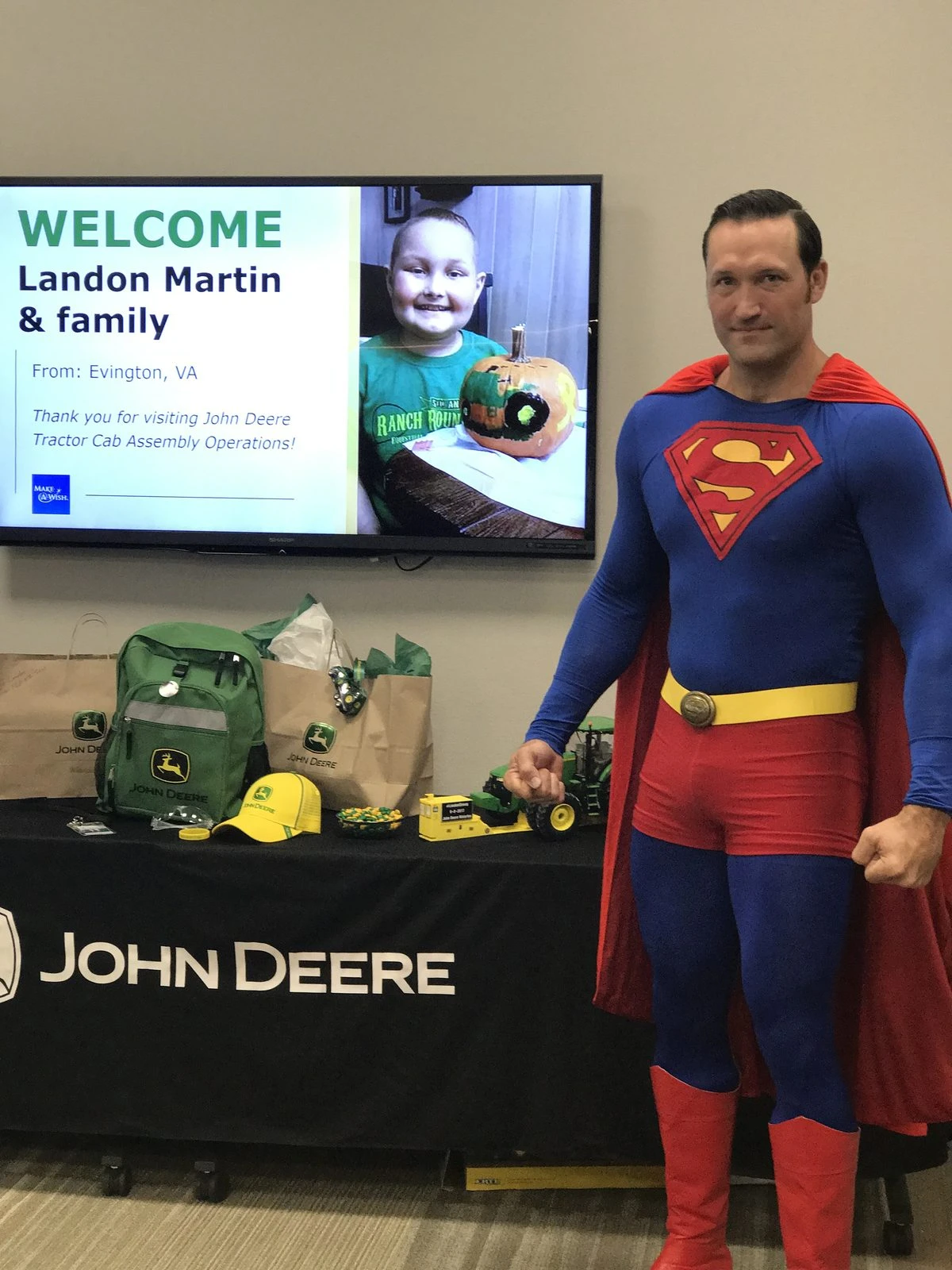 John Deere employee dressed as Superman for Make-A-Wish child Landon Martin