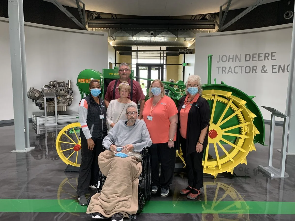 His hospice nurses were there for every moment of his visit to the John Deere museum