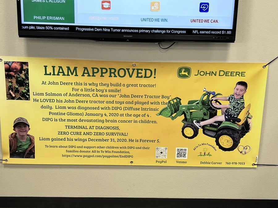 Father capturing Liam's Make-A-Wish visit at John Deere